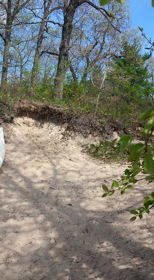 Taking the inflatable boat down to the water. 